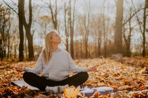 woman meditating in nature